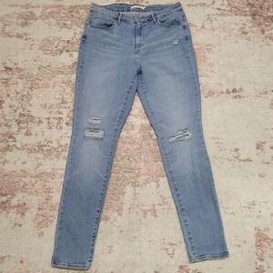 Levi's 721 High Rise Light Medium Wash Distressed Jeans - 31